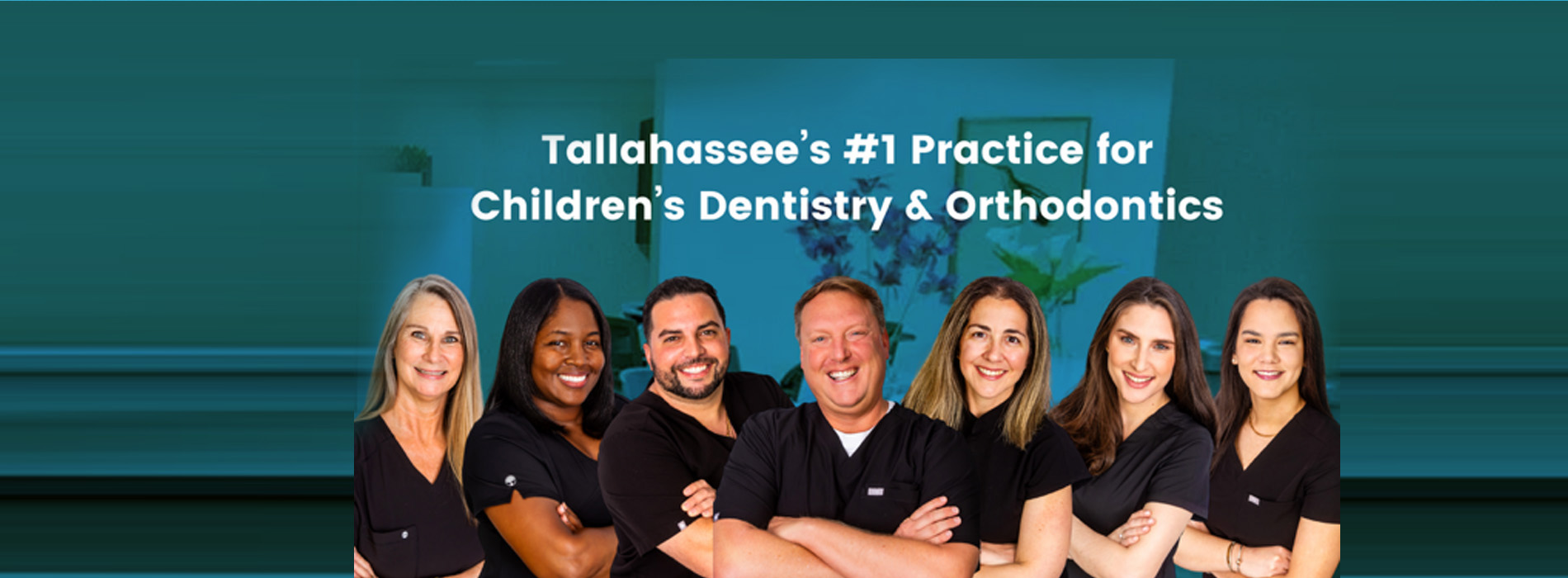 The image is a screenshot of a webpage with a group of individuals posing for a photo, likely related to dental or medical education. They are standing in front of a background that includes text and logos, suggesting they might be part of an educational institution or program.