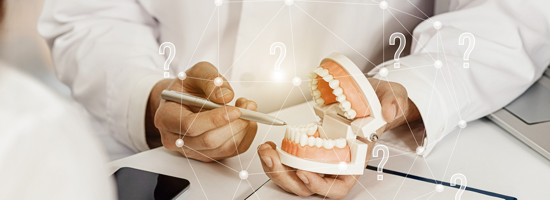 The image shows a person s hand holding a dental implant with a digital interface overlaying the scene, displaying various icons and numbers related to dental care or implants.